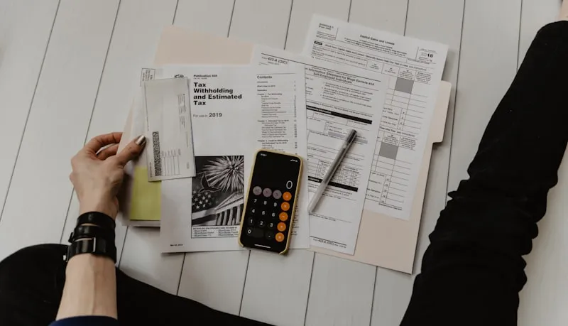 Business owner analyzing profit margins on financial reports