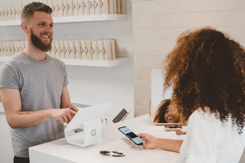 Retail store owner reviewing product pricing strategy