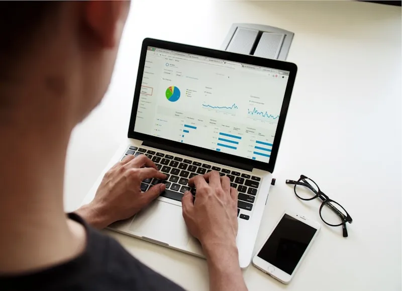 Small business owner analyzing profit margins and financial reports